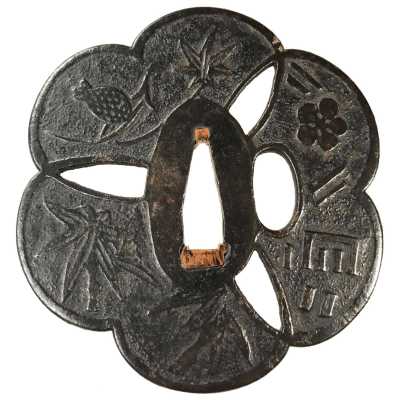 A metal tsuba (sword guard) featuring a bird (sparrow) perched on bamboo branches, and several other designs including leaves (foliage) and flowers (blossoms). The central cut-out is keyhole-shaped, surrounded by engraved motifs variously distributed across the circular guard."