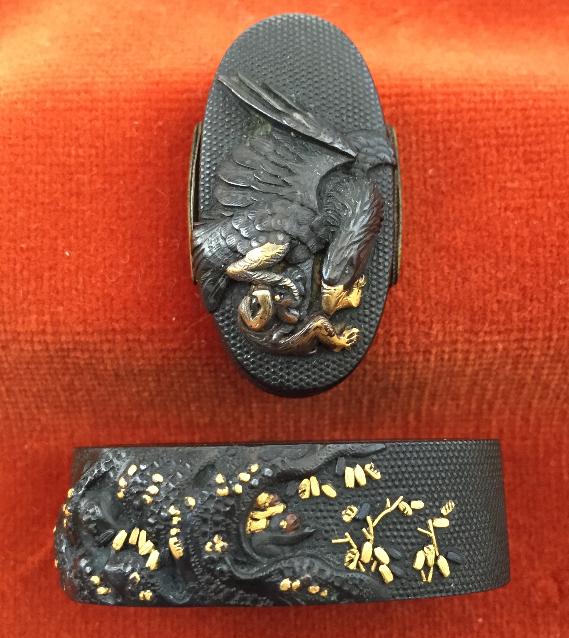 Fuchi-kashira with designs of eagle holding a monkey, and young monkey sheltering under a tree.