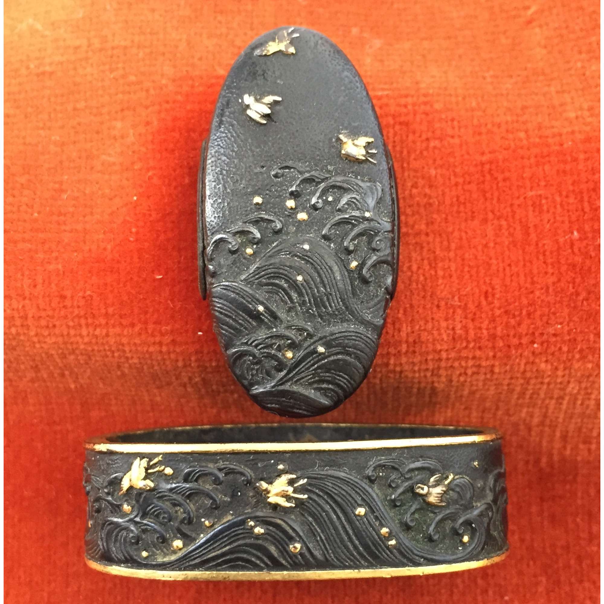 Fuchi-kashira with designs of plovers above the waves