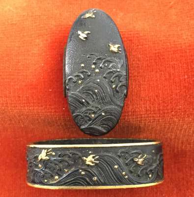 Fuchi-kashira with designs of plovers above the waves