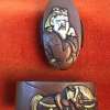Fuchi-kashira with designs of warrior and horse