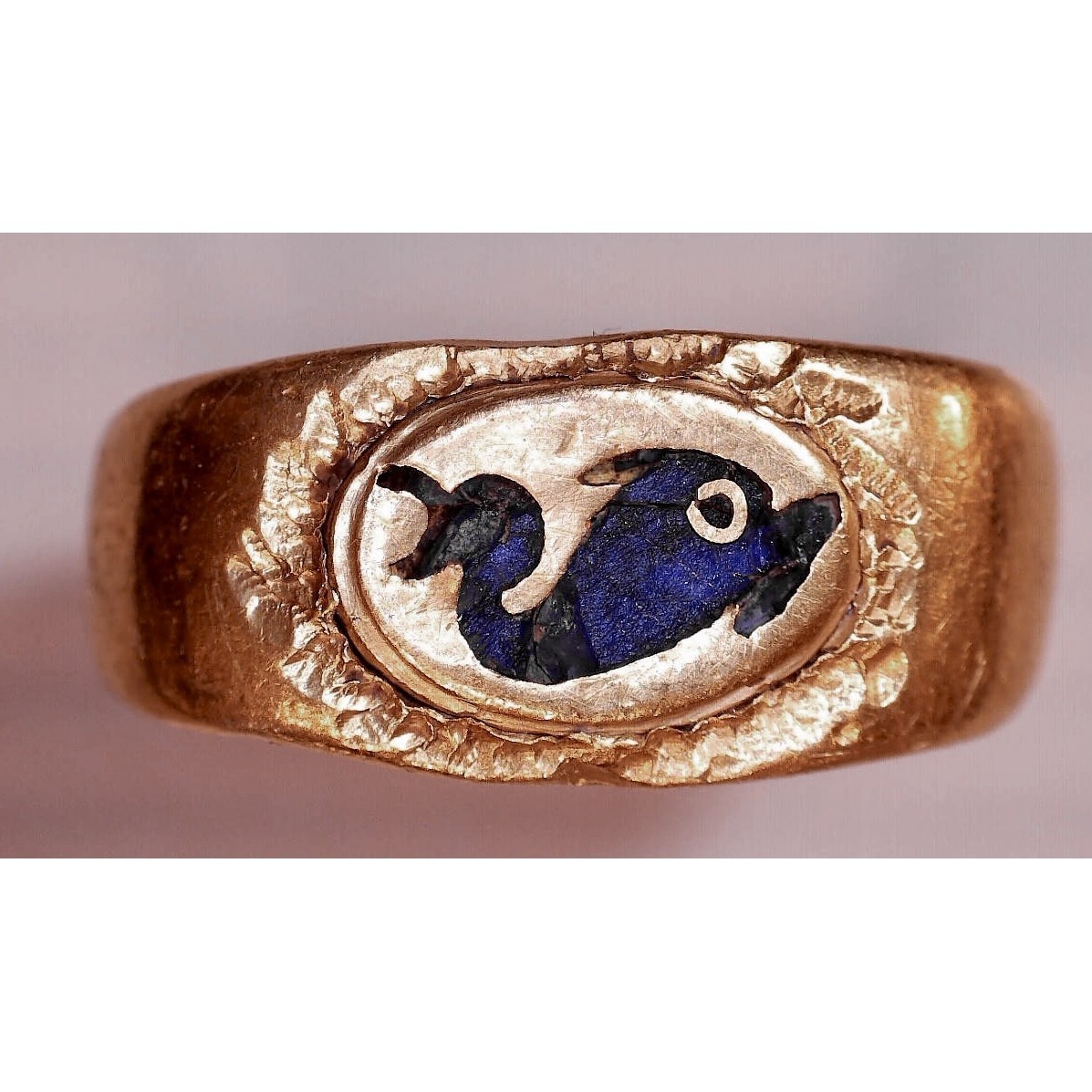 Gold ring with inlaid dolphin. Roman Empire, 1st-3rd century AD.